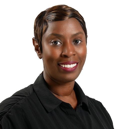 Portrait of a smiling person wearing a black shirt with a white background.